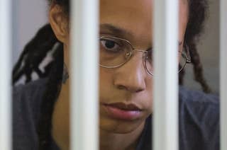 Griner is seen behind bars