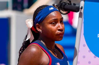 Tennis player Coco Gauff in athletic wear and headband, during a match at the Paris 2024 Olympics